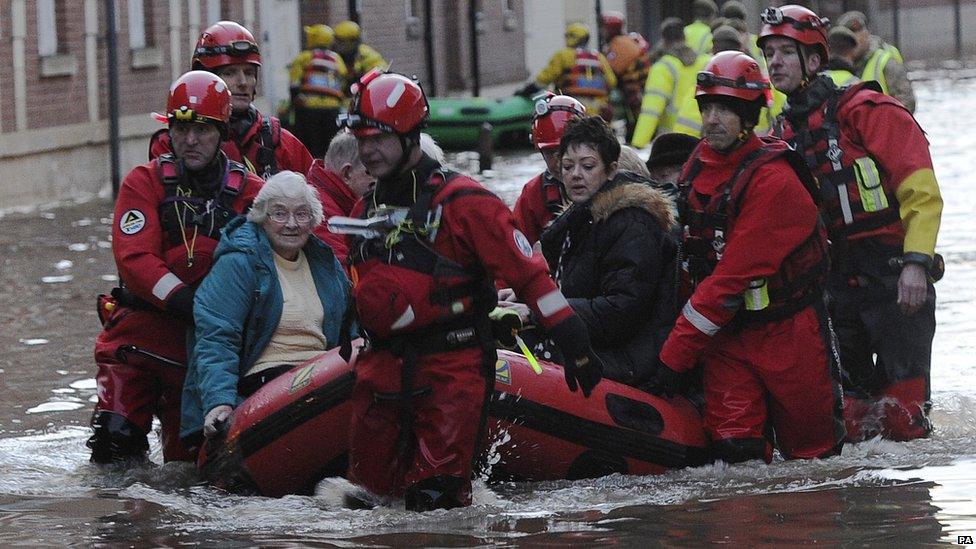 Members of Cleveland Mountain Rescue and soldiers from 2 Battalion The Duke of Lancasters Regiment assist members of the public as they are evacuated from the Queens Hotel in York city centre