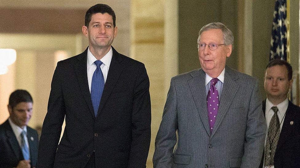 House Speaker Paul Ryan and Senate Majority Leader Mitch McConnell walk through Congress.