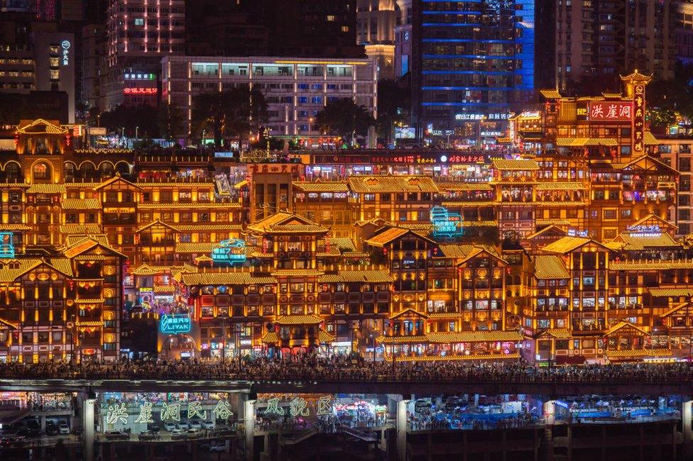 Tourists visit the Hongya Cave scenic spot during the Mid-Autumn Festival and National Day holiday on September 30, 2023 in Chongqing, China.