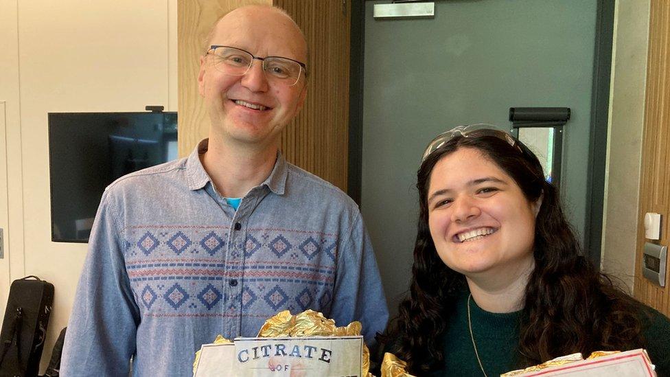 Marcin Dobrowolski and Neti Licht holding some chocolate