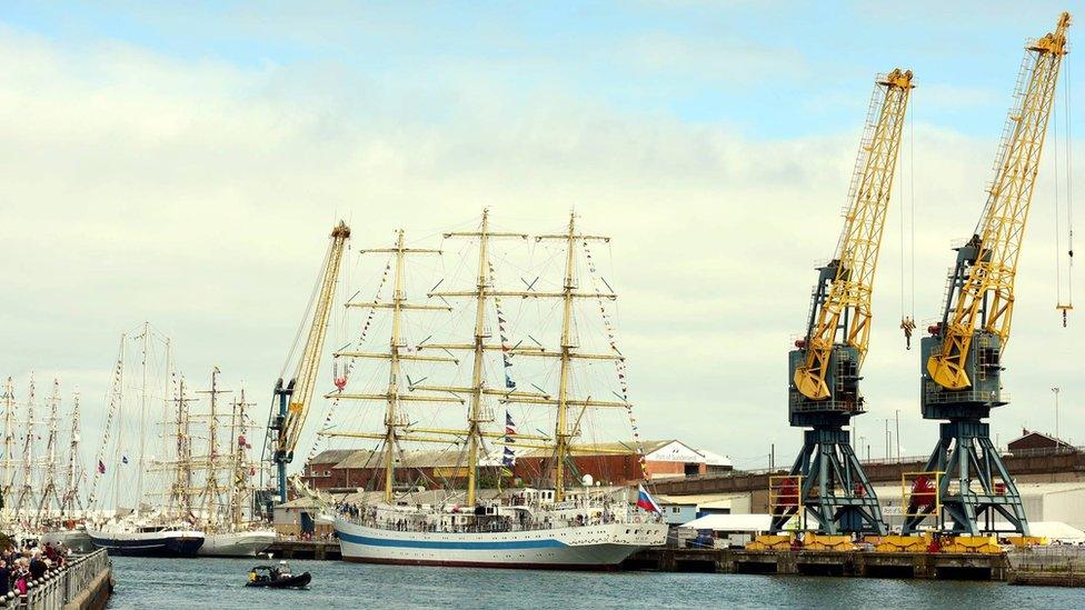 Tall ships next to cranes in Sunderland