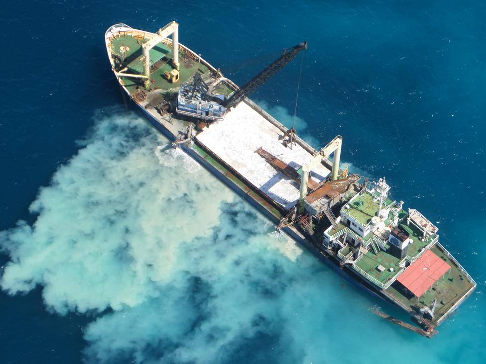 A sand dredger just beyond the reef in Tiwi, Kenyan coast, kicks up giants plumes of sand clouds in the ocean. This sand settles over coral, suffocates fish, and muddies the waters for sea turtles who feed on the seagrass at the bottom.