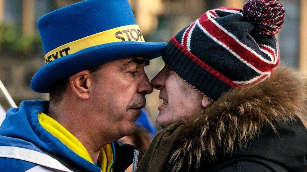 Anti-Brexit protester Steve Bray (L) and a pro-Brexit protester argue as they demonstrate outside the Houses of Parliament in Westminster