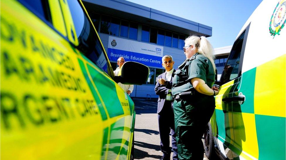 London mayor next to ambulances and staff