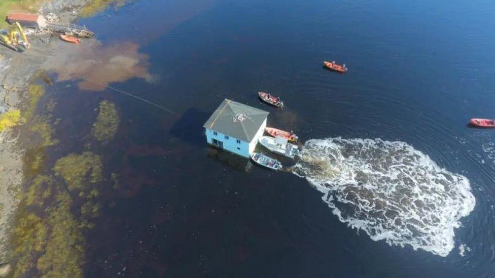 house-moving-across-water.