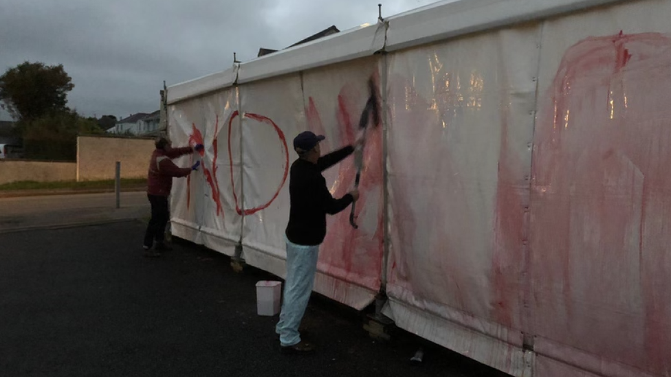 Marquee with graffiti sprayed on it