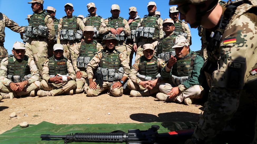 File photo showing Iraqi Kurdish Peshmerga fighters listening to a German military trainer at a camp in Irbil, Iraq (9 March 2016)