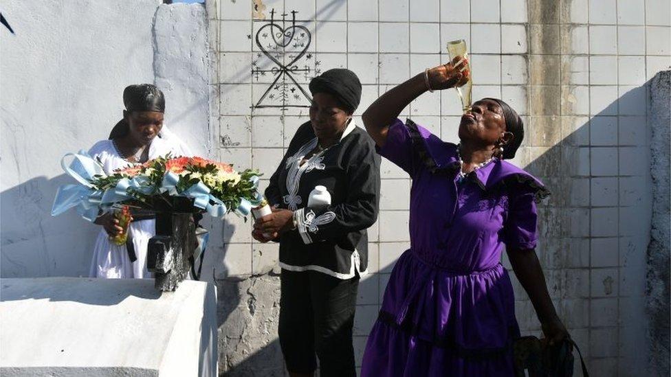 Voodoo followers take part in ceremonies honouring the Haitian voodoo spirits of Baron Samdi and Gede during Day of the Dead in a cemetery in Port-au-Prince, Haiti on November 1, 2015