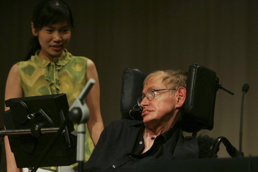 British scientist Stephen Hawking looks at a Chinese student at a conference during the 2006 International Conference on String Theory on 21 June 2006 in Beijing, China