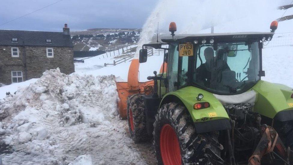 Snow blower plough through huge piles of snow