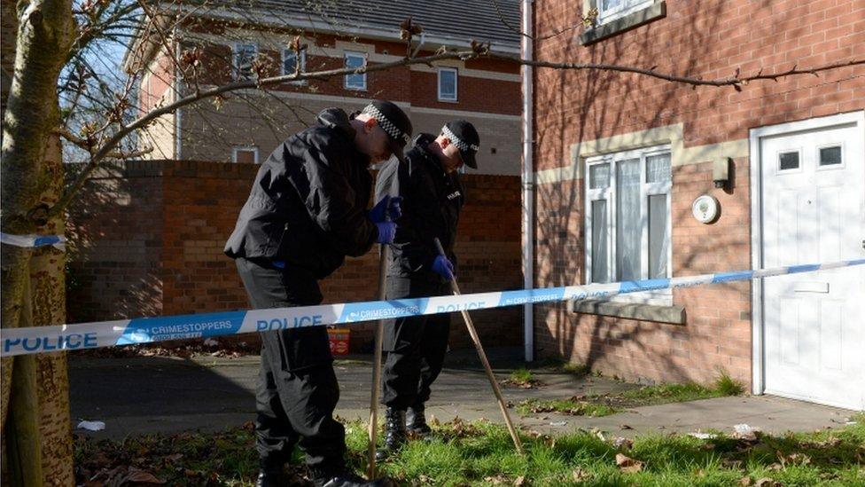 Police search the garden