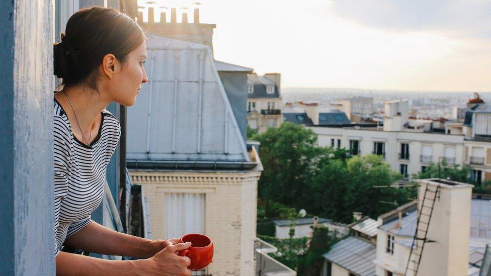 A woman on a balcony