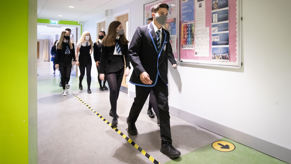 Students at St Columba's High School, Gourock, wear protective face masks as they head to lessons as the requirement for secondary school pupils to wear face coverings when moving around school comes into effect from today across Scotland.