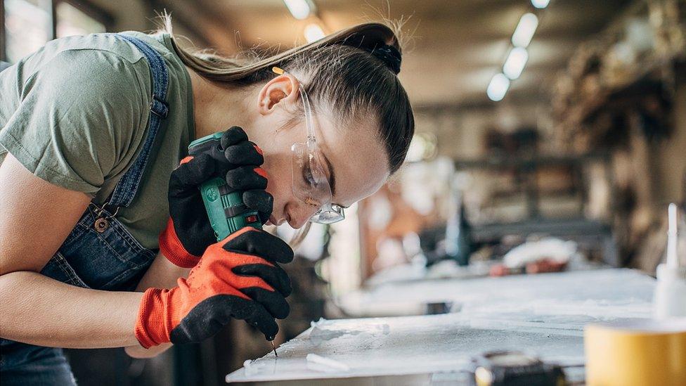 Woman using a drill