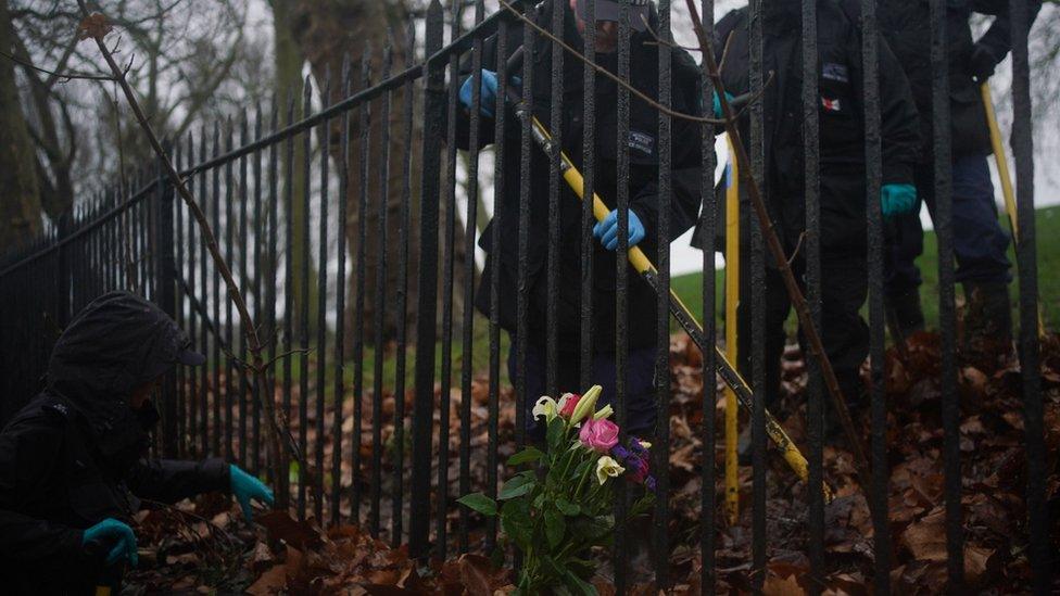 Police officers conduct a search on Primrose Hill in Camden