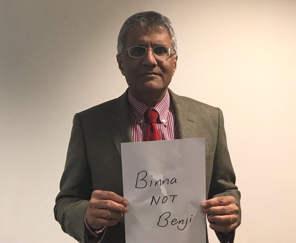 Binna Kandola holding up a sign saying "Binna NOT Benji"