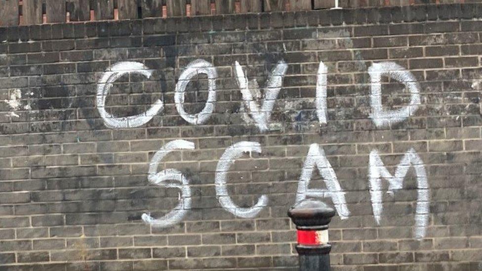 Covid scam graffiti