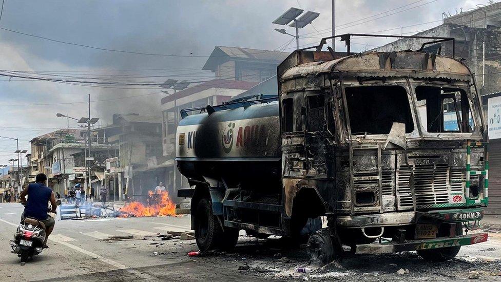 Burnt out water tanker in Manipur state, India