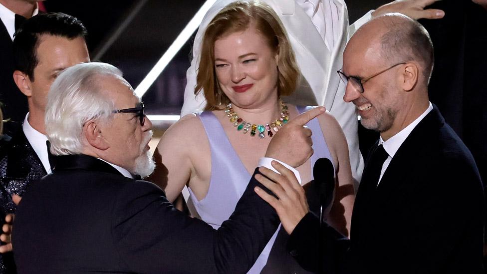 Succession stars Jeremy Strong, Brian Cox and Sarah Snook with creator Jesse Armstrong (right) on stage at the Emmys