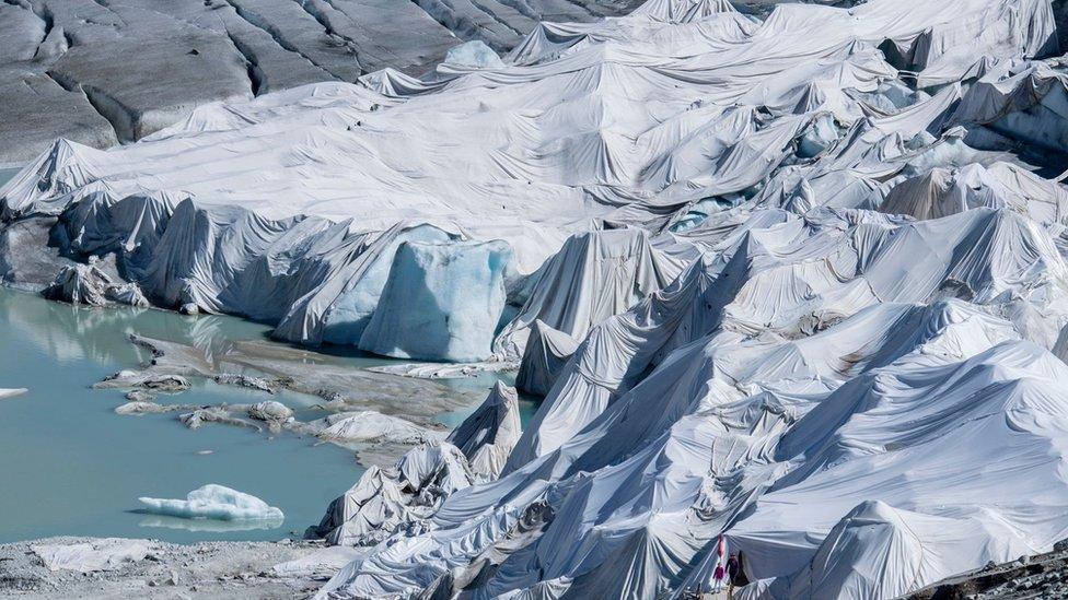 Swiss alps covered by special blanket