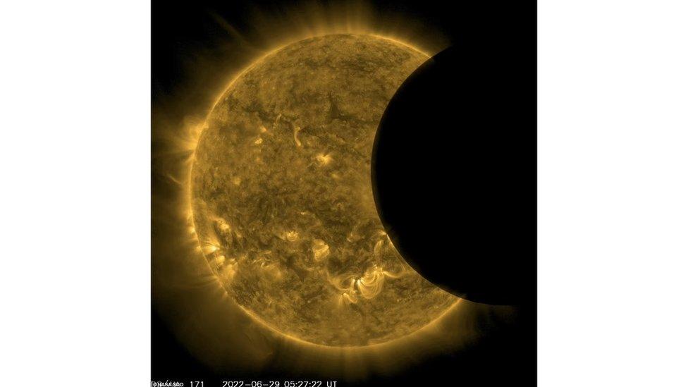 The moon has moved almost completely across the surface of the Sun to the right