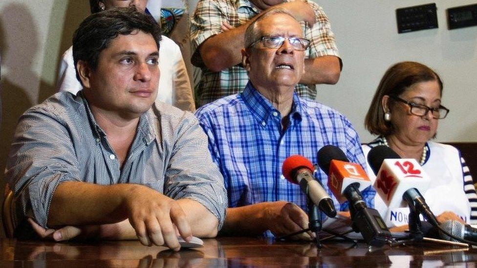 Representatives of the opposition Frente Amplio por la Democracia party Eliseo Nunez (2nd L), Violeta Granera (R) and Carlos Noguera attend a press conference after the closing of the voting during presidential elections, on November 6, 2016.