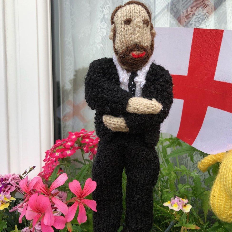 Knitted England players in a window box