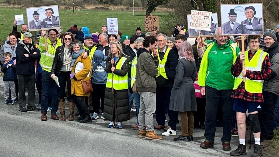 Placard-waving protesters