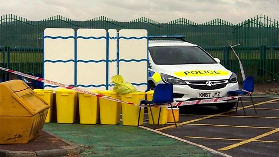 Police car next to decontamination area