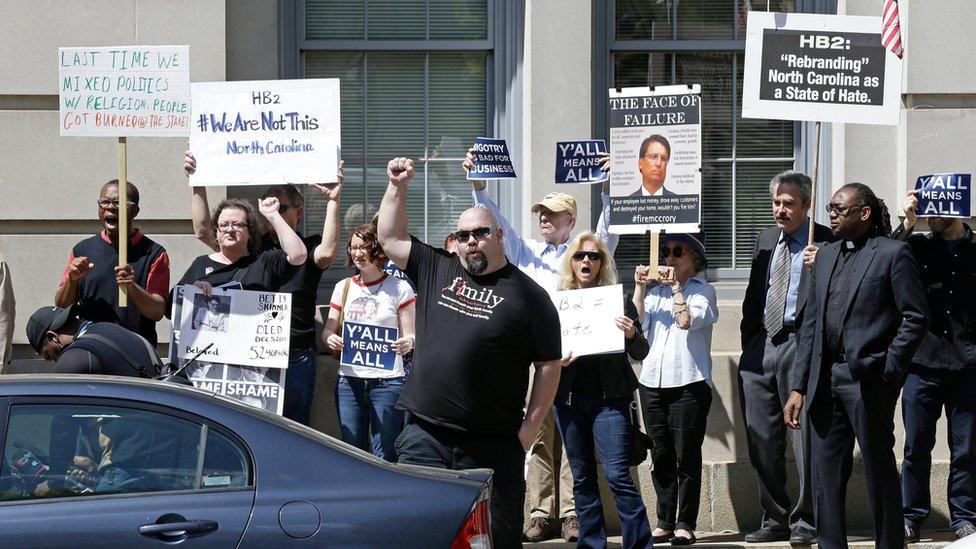 Opponents of House Bill 2 protest across the street from the North Carolina State Capitol in Raleigh, North Carolina