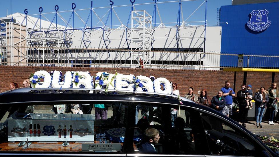 The funeral cortege passes close to Goodison Park