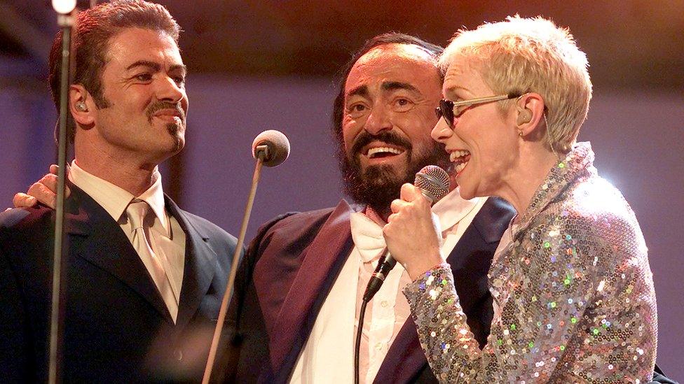 Italian tenor Luciano Pavarotti (C) performs with George Michael and Annie Lennox during the Pavarotti Friends concert in Modena June 6, 2000