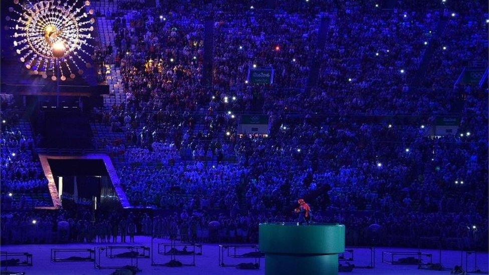 Japanese Prime Minister Shinzo Abe, dressed as Super Mario, holds a red ball during the closing ceremony of the Rio 2016 Olympic Games at the Maracana stadium in Rio de Janeiro on August 21, 2016. / AFP PHOTO / LUIS ACOSTALUIS ACOSTA/AFP/Getty Images