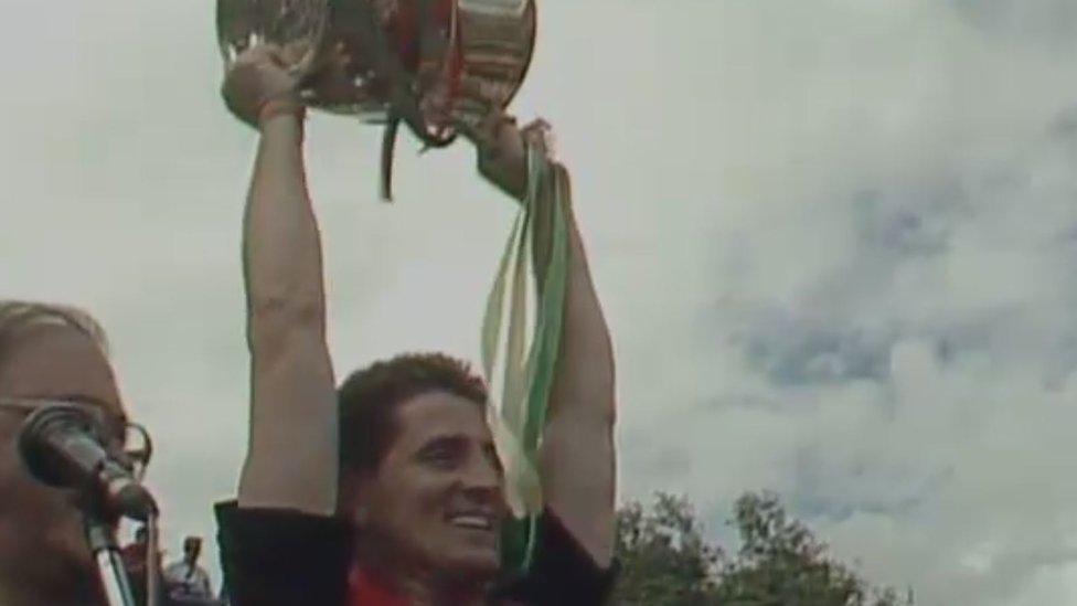 Down captain Paddy O'Rourke lifts the Anglo-Celt Cup after Down win the Ulster Championship