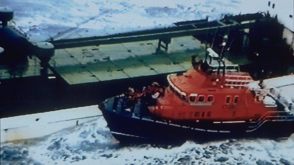 Volunteers from the Lerwick lifeboat come to the aid of the Green Lily 19 November 1997