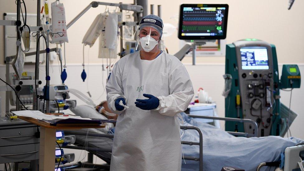 A member of staff at University Hospital Monklands attends to a Covid-positive patient on the ICU ward on February 5, 2021