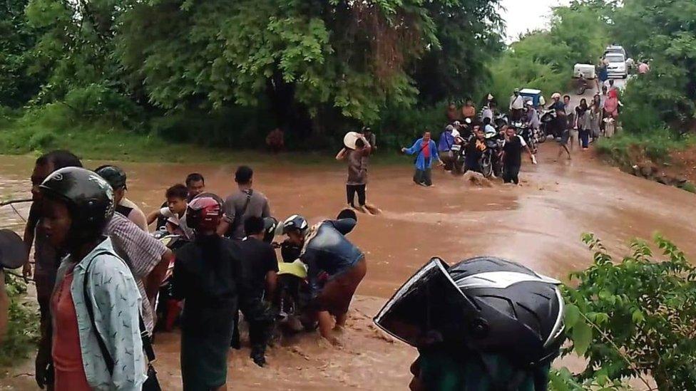 Villagers in Myanmar flee their homes as the storm approaches