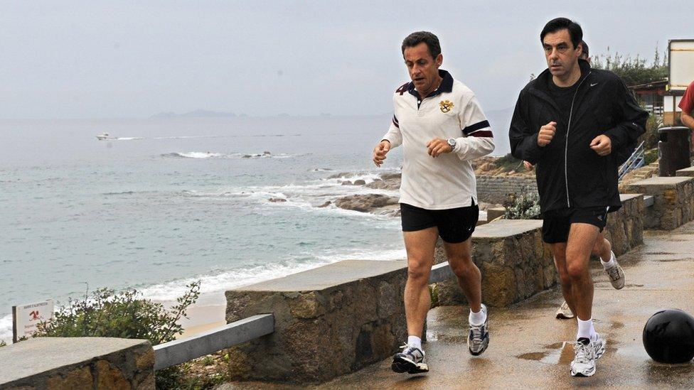 Then-French President Nicolas Sarkozy (L) and Francois Fillon jogging