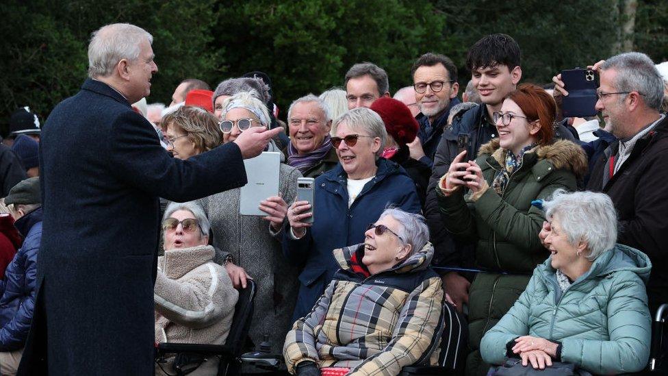 Prince Andrew speaking with a crowd