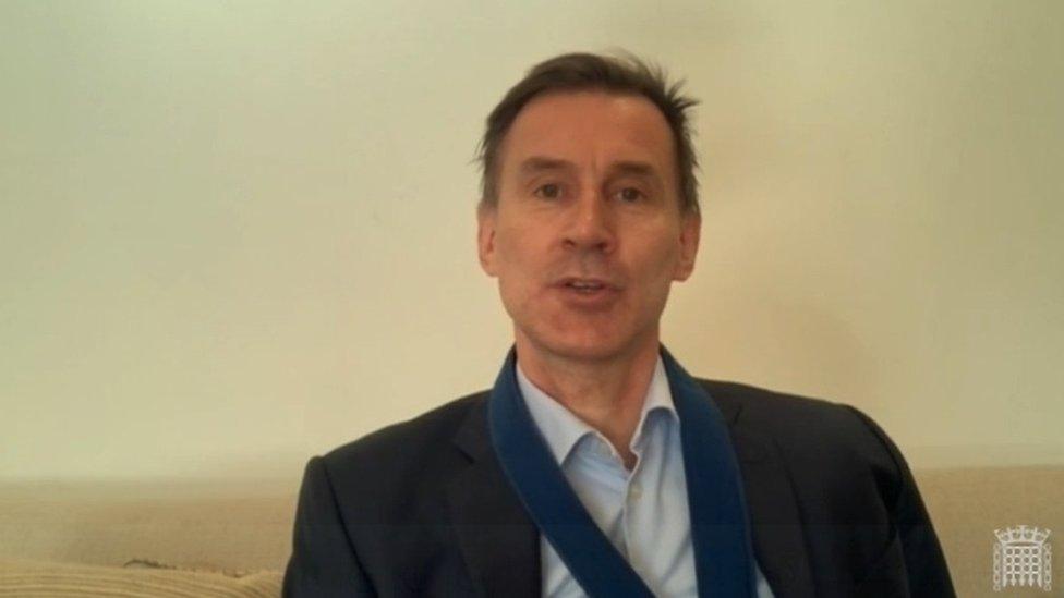 Jeremy Hunt appearing on video with his arm in a sling