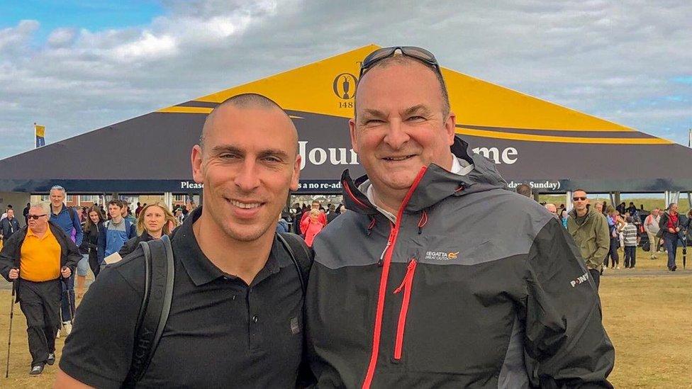 Celtic captain Scott Brown and a Rangers fan