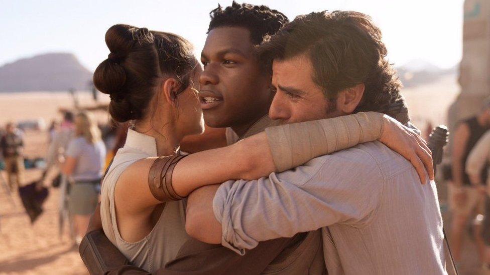 Daisy Ridley, John Boyega, and Oscar Isaac.