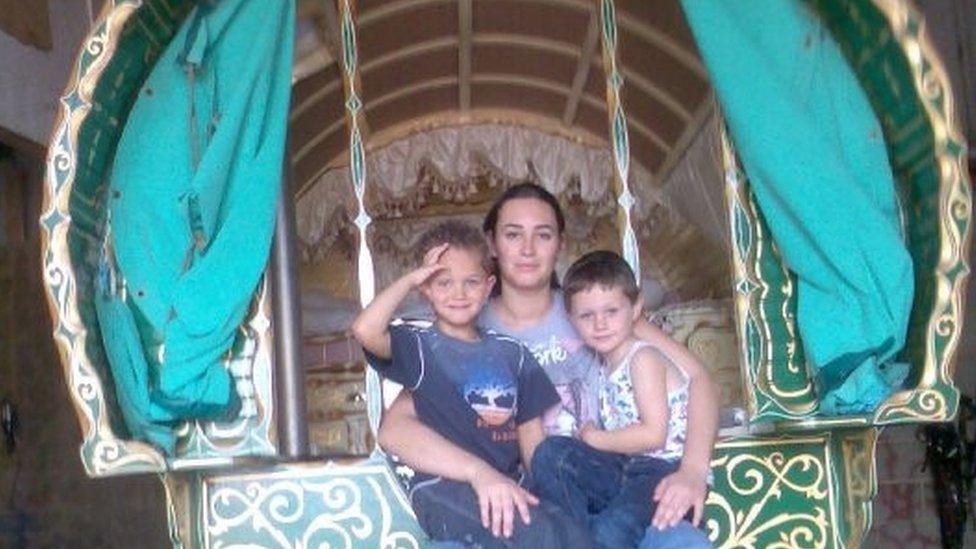 Debbie, with her cousins, sitting on the steps of her grandfather's wagon