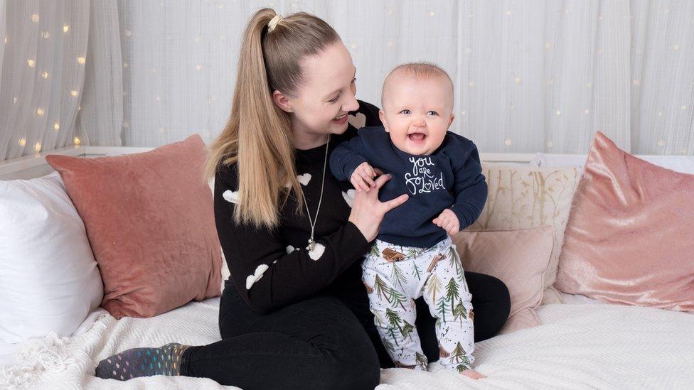 Ali Harris playing with baby Indy