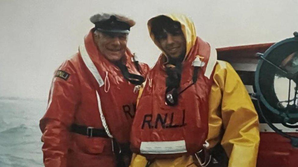 Trevor Holland and his father Ken Holland