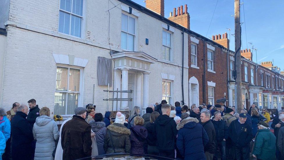 Crowd gathering at the unveiling