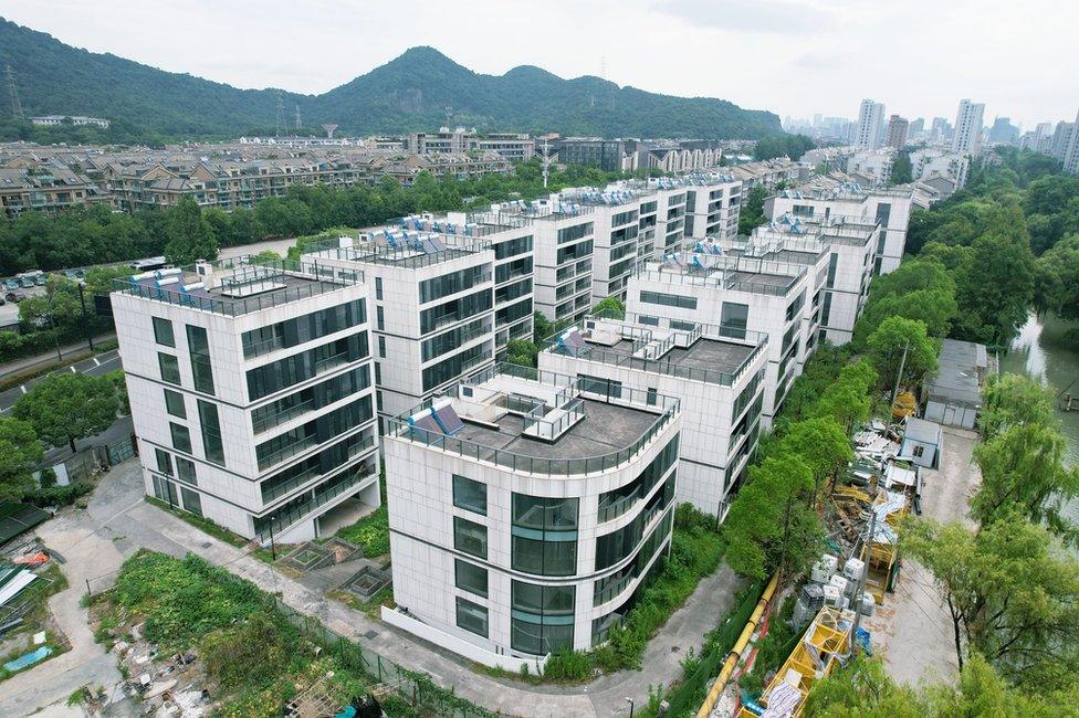 An aerial view of the unfinished luxury housing development that has existed for more than a decade by the Qiantang River in Hangzhou, East China's Zhejiang Province, July 18, 2022.