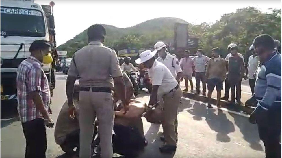 Police tie Dr Rao's hands