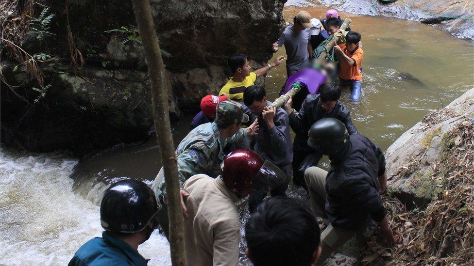 Emergency workers climbed down the falls to recover the bodies