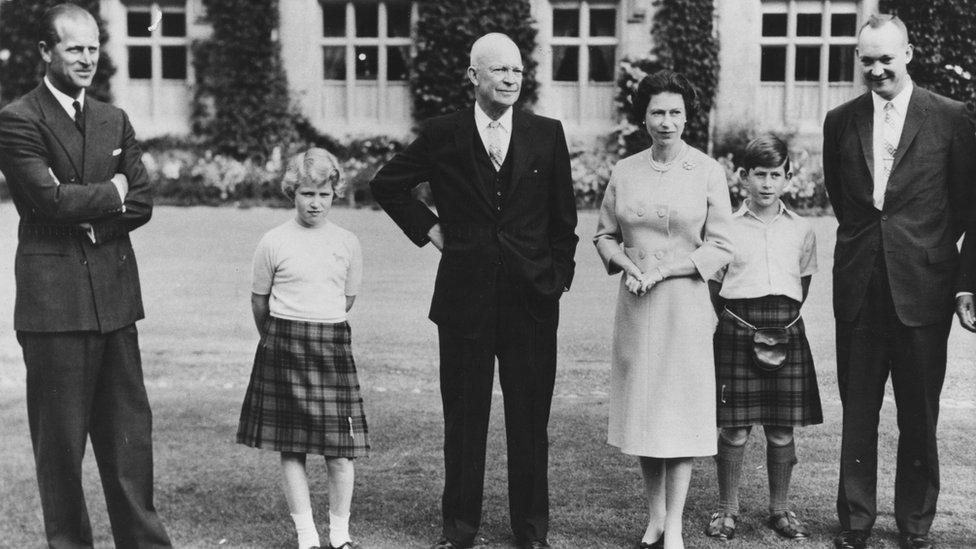 President Eisenhower (centre) with the British Royal family (L-R) Prince Philip, Princess Anne, HM Queen Elizabeth, Prince Charles and Captain John Eisenhower, at Balmoral Castle, Scotland, September 1959.